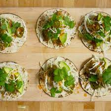 Top tortillas (we like two per taco) with fish, slaw, hot sauce, avocado, cilantro, and jalapeños. Bon Appetit Magazine How To Make Fish Tacos Facebook