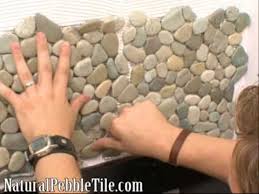 Bring the outdoors in or leave the natural beauty of river rock mosaics outdoors to add unique detail to any bathroom, kitchen, hearth surround and cabana. Natural Pebble Tile On Diy Network S Bathtastic Youtube