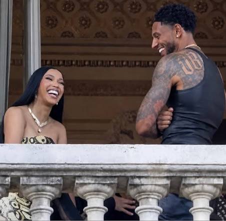 Spotted! 👀 Looks like Cardi B is all smiles (and maybe a little flirty?)  with Super Eagles star Maduka Okoye in these new photos! 🔥 They're seen  laughing on a balcony ⁠and