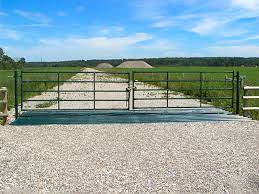 A concrete watering trough providing fresh, clean water for cattle. Cattle Guards Texas Gates Hi Hog