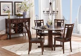 Dining set features a warm cherry finish, ribbed trim w/stainless steel edges and capped feet, tapered legs, bowed ends, and includes 6 chairs. Undefined Round Dining Room Table Round Dining Room Sets Round Dining Room