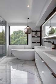 See more ideas about bathroom design, design, contemporary bathroom designs. Clean White Bathroom With A Freestanding Bathtub And White Vanity Sink Beneath Front Glass Modern Bathroom Contemporary Bathrooms Contemporary Bathroom Designs