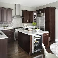 Pin By Sharesa Alexander On Kitchen Ideas Trendy Kitchen Backsplash Brown Kitchen Cabinets Contemporary Kitchen