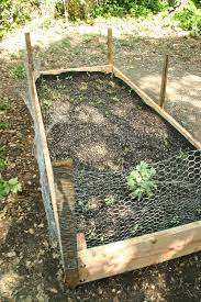 Bury the wire twelve inches deep to prevent tunneling. How To Build A Wooden Raised Bed Planter Box Dear Handmade Life