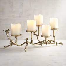 A glass candle holder centerpiece helps beautify your table throughout the year. Metal Bird Centerpiece Candle Holder Gold Metal Candle Stand Metal Candle Holders Candleholder Centerpieces