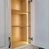 Unwrap the package of the led strip lights and stick the strip onto the cabinet. 3