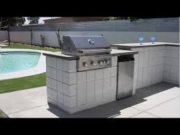 First row of cinder blocks are down. How To Build A Custom Bbq Fire Pit With Cement Blocks Youtube