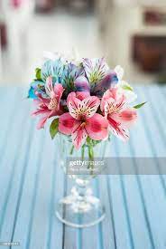 Alstroemeria Flower Bouquet In A Glass Vase Over A Light Blue Wood Alstroemeria Bouquet Lily Bouquet Wedding Alstroemeria Wedding