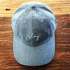 The Newest Trend Dad Hats Distinguished By An Unstructured Silhouette With A Shallow Cotton Or Canvas Crown And Pre Curved Br Dad Hats Suede Caps Headwear
