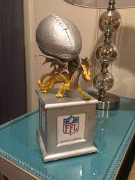A night of fetching drinks while wearing this little number should hopefully motivate your league loser to bring their a game next season. Fantasy Football Trophy Fantasy Football Gifts Fantasy Football Trophy Fantasy Football Shirt