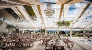 Stunning Clear Roof Wedding Marquee With Rustic Furniture And Ivory Roof Overlays By Academy Marquees Wedding Clear Marquee Festoon Lighting Marquee Wedding