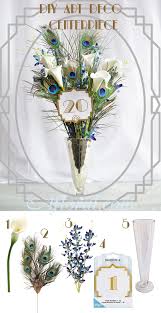 Art Deco Wedding Centerpiece With Peacock Feathers Calla Lily And Mini Orchid Spray Art Deco Wedding Centerpieces Art Deco Centerpiece Wedding Centerpieces Diy