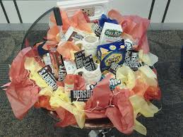 The warmth of a fire pit will instantly cozy up any outdoor room. Campfire Raffle Basket Fire Pit As The Base S Mores Supplies Blankets Mugs Fire Logs Off Lighter Owl Mug Raffle Baskets Raffle Basket Fundraiser Baskets