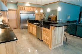 This post will give you 5 important questions that will help you decide. Hickory Cabinets Black Stone Countertops And A Light Tile Floor Discount Kitchen Cabinets Minimalist Kitchen Design Modern Kitchen Design