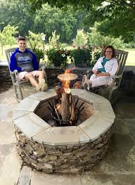 An Enjoyable Afternoon Around This Large Round Outdoor Fireplace Outdoor Fire Pit Fire Pit Backyard Outdoor Fire