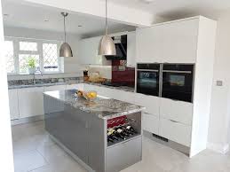 For the contemporary look and to make your kitchen feel light and airy, opt for a neutral palette. White And Grey Gloss Kitchen Hallmark Kitchen Designs