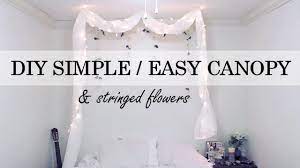 Curtains around your bed can give you a luxurious canopy look for a low price. Diy Simple No Nail Canopy Stringed Flowers Wall Decor Youtube