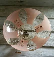 Most of these fans are operated with pull switches to adjust the speed and light settings. Vintage Pink Glass Three Chain Light Cover Etsy Pink Glass Light Covers Vintage Pink