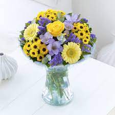 These Lemon Germini Compliment The Lilac Freesias And Statice Wonderfully Yellow Wedding Centerpieces Lilac Wedding Peach Wedding Flowers