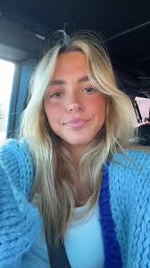 Blonde Individual in Blue Sweater Inside Vehicle