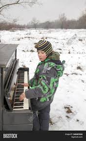 The beginner's guide to learning piano gives you everything you need to know to get going, safe in the knowledge you're doing it right. Boy Playing Piano Image Photo Free Trial Bigstock