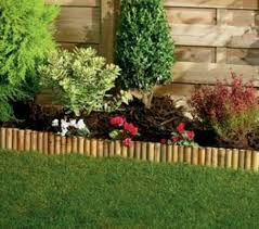'the arcadian lawn edging system can be used as a mowing edge alongside flower borders, around a tree or as a kerb to paths and driveways. Wickes Bamboo Edging Roll 150mm X 1m Wickes Co Uk Courtyardgarden Courtyard 150mm Bamboo Courtyard Bamboo Garden Bamboo Garden Fences Garden Edging