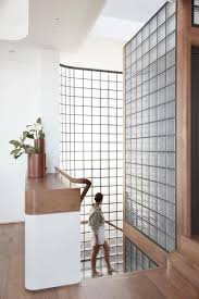 The Walls Of Glass Blocks Surrounding These Stairs Help To Provide Natural Light While Maintaining Privacy In 2020 Glass Blocks Glass Blocks Wall Stairs Design