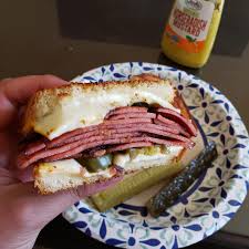 A fried bologna (c'mon, we know it's pronounced baloney, no matter how it's spelled) sandwich occupies that delicious middle ground between sentimental southern comfort food and charming throwback party fare. A Fried Bologna Sandwich On Saturday Afternoon Shittyfoodporn