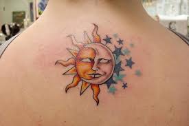 Because the moon is always at night and night= dark and she is pretty lonely.that why. Half Sun And Moon With Stars Tattoo On Girl Upper Back