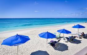 Cayman Reef Resort Beach With Umbrellas And Beach Chairs Beach Chair Umbrella Island Vacation Rentals Beachfront Vacation Rentals