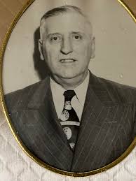 Ok, here is a neat old photo from March 1961. These guys are setting up the  library in the ( then) new high school. The man