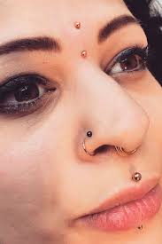 Tips And Tricks To Learn Before Getting A Nose Piercing Nose Piercing Big Hoop Earrings Sparkly Earrings