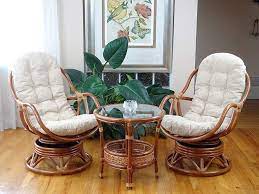 Set Of 2 Bali Lounge Swivel Rocking Chairs With Cream Cushion And Pelangi Round Coffee Table Natural Ra Wicker Swivel Chair Swivel Rocking Chair Brown Cushions