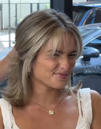 Who is a highly recommended hair stylist for a post-wedding chop in Grand  Blanc?