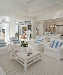 Chic Bright And Airy Living Room In All White Furniture And Little Blue In Details Beach Hous Beach House Interior Beach Theme Living Room Beach Living Room