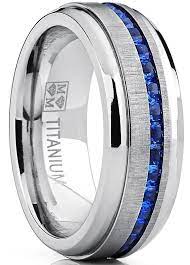 This Stylish Eternity Ring Is A Comfort Fit It Has A Horizontal Brushed Raised Center With Chann Blue Wedding Rings Titanium Wedding Band Wedding Rings Unique
