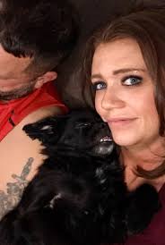 Modelling for my new teddy bear sofa. Think he likes it.