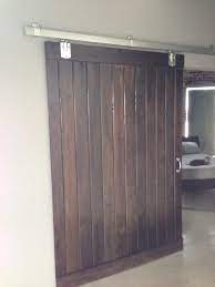 A piece of 6″ x 1 1/2″ wood formed the header and it was stained a medium gray to match the shiplap boards. My Husband Made This Barn Door Out Of Pine Tongue Groove Boards And Hardware From The Local Tr Garage Door Design Sliding Barn Door Hardware Barn Door Colors