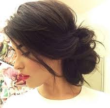 The lovely hairstyle in the photo gives a feel of extremely voluminous and a bit messy curls which fall out of the do, but the look remains neat and exquisite. Beach Wedding Hairstyles The 20 Breeziest Ones To Fall In Love With
