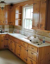 I searched for knotty pine on pinterest and discovered my diy kitchen remodel pinned here! A Little Kitchen Lightens Up Kitchen Remodel Small Pine Kitchen Cabinets Kitchen Remodel