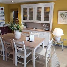 Here the table is shown in cherry with a painted glazed base. Showroom Robert James Interiors