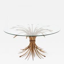 Features metal in a stylized sheaf of wheat shape with curving legs in white and green washed finish and brown details. Incollect