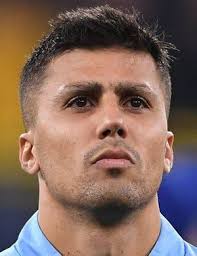 Can you identify the football players in this vintage team photo?