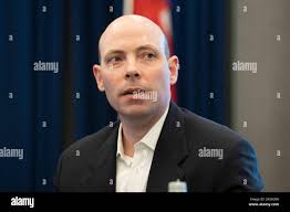 Texas Gov. Greg Abbott joins Maj. Gen. William "Len" Smith, left, deputy  adjutant general and commander of the Texas Army National Guard, Sgt.  Michael Cantu, Spc. James Burkett, Spc. Jose Romo, Staff