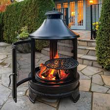 This rustic and rusty steel fireplace on wheels not only looks great, it keeps smoke from billowing into your eyes like an open pit, blocking. Rustic Outdoor Fireplace Chimnea With Cooking Grill Fire Pit Firepit Barbecue Amazon Co Uk Garden Outdoors