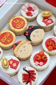 To celebrate chinese new year, we read chinese new year books as a family and have shared some stories with classmates. Chinese New Year Cupcakes Chinese New Year Cake Chinese New Year Desserts New Year S Cupcakes