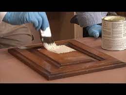 The 90's and early 2000's were filled with an influx of builder grade, stained oak cabinets and as we transitioned to 2010 and now almost 2020 those are far from in style. Steps In Painting Kitchen Cabinets That Are Stained Restoring Painting Kitchen Cabinets Youtube
