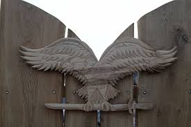 The origins of the turul legendry go way back to prehistoric hungarian past. Hd Wallpaper Turul Bird Coat Of Arms Carving Wood Fence Decor Wings Wallpaper Flare