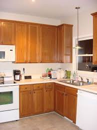 Old Oak Cabinets Painted White And Distressed Diy Kitchen Cabinets Painting Kitchen Cabinets White Beautiful Kitchen Cabinets