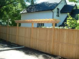 The hollow, metal fence posts are set in concrete, making it. Incorporate A Pergola To Add Height To Your Sandringham Cedar Fence Supplied And Installed By Lanark Cedar Pergola Cedar Fence